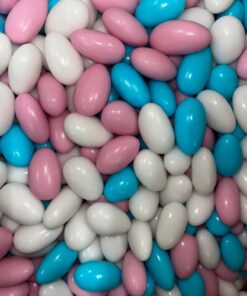 a pile of white and pink candy eggs