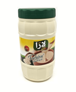 a white plastic container with a green lid